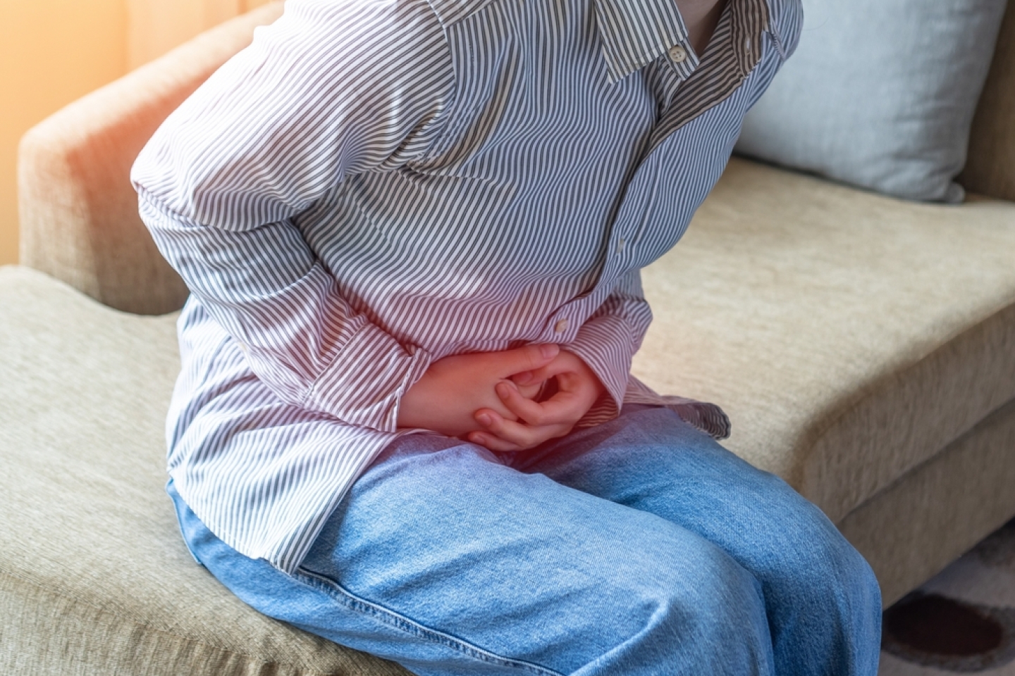 Abdominal pain in young woman with stomachache illness, menstruation cramps, stomach cancer, irritable bowel syndrome, pelvic discomfort, Indigestion, Diarrhea or GERD gastro-esophageal reflux disease