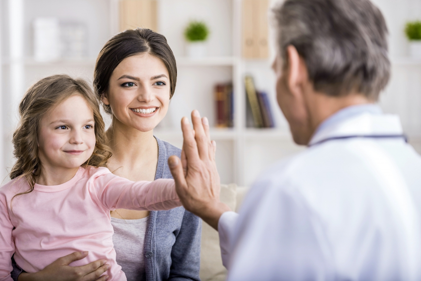 young patient with mom and doctor