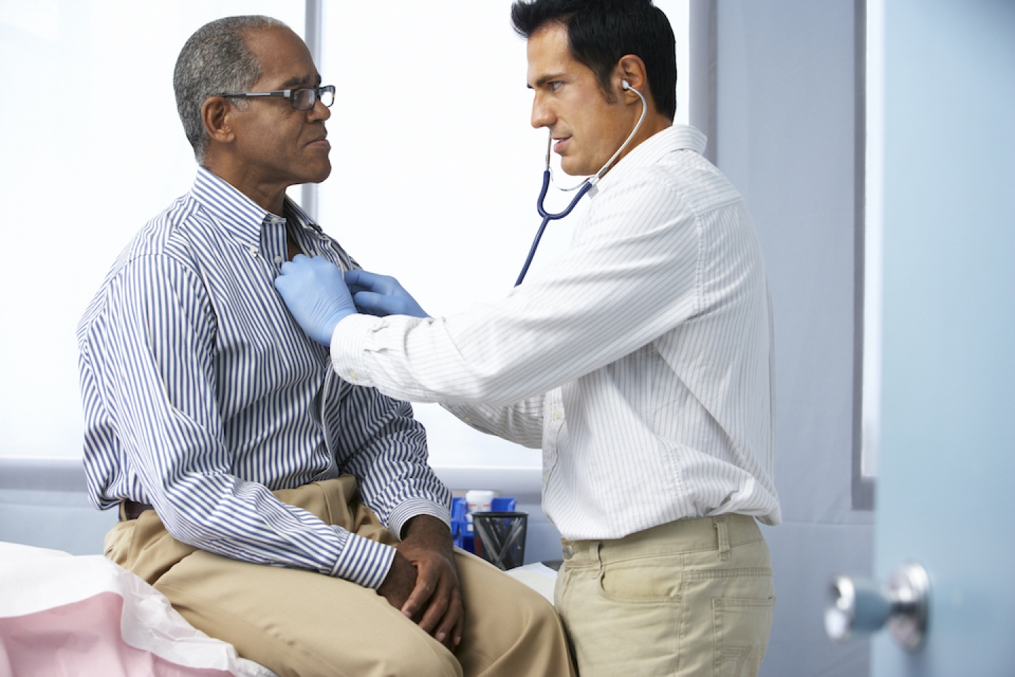 older black man meets with male doctor