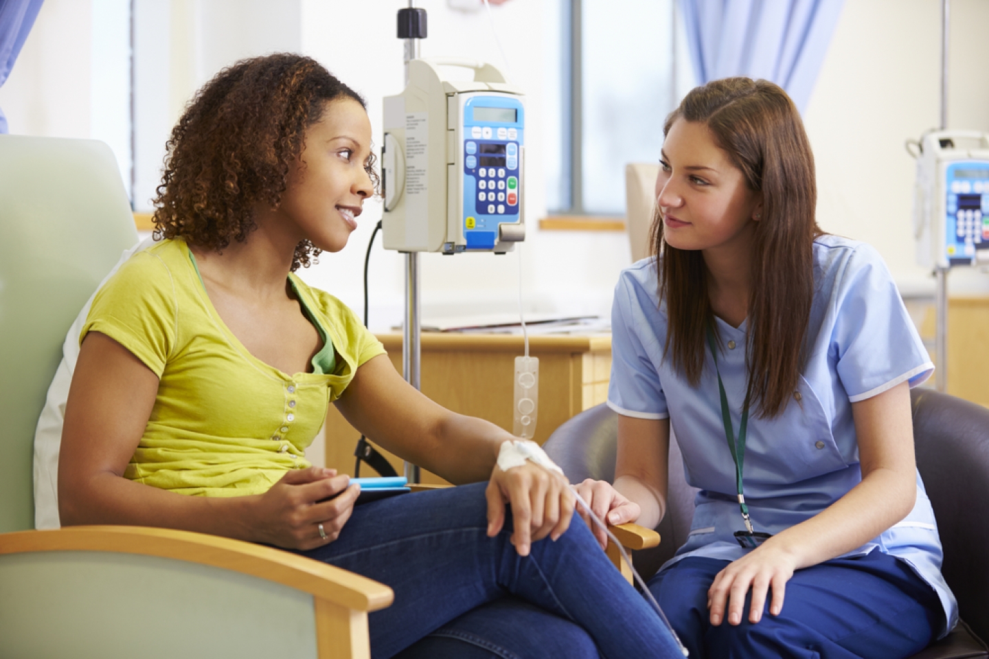 Woman Undergoing Chemotherapy With Nurse