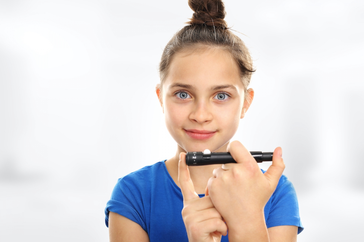 girl checking her blood sugar