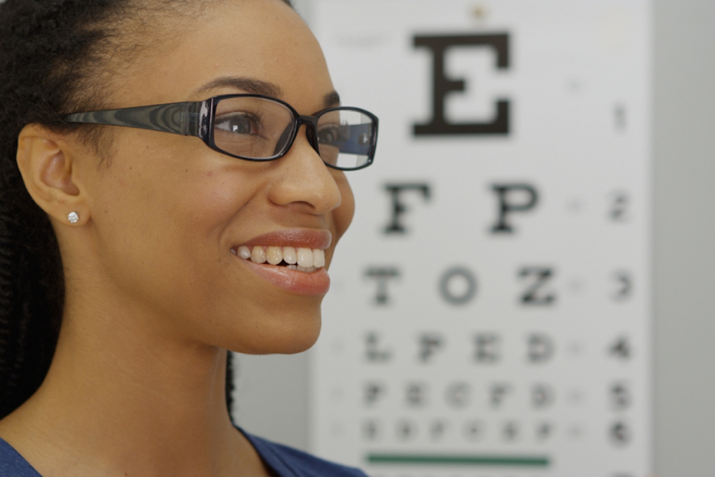 African woman trying on her new glasses