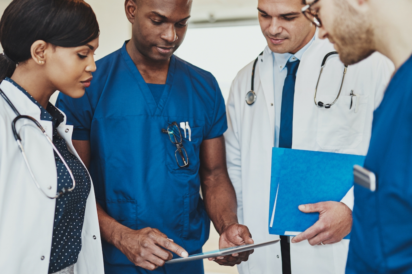 doctors gathering together to discuss care