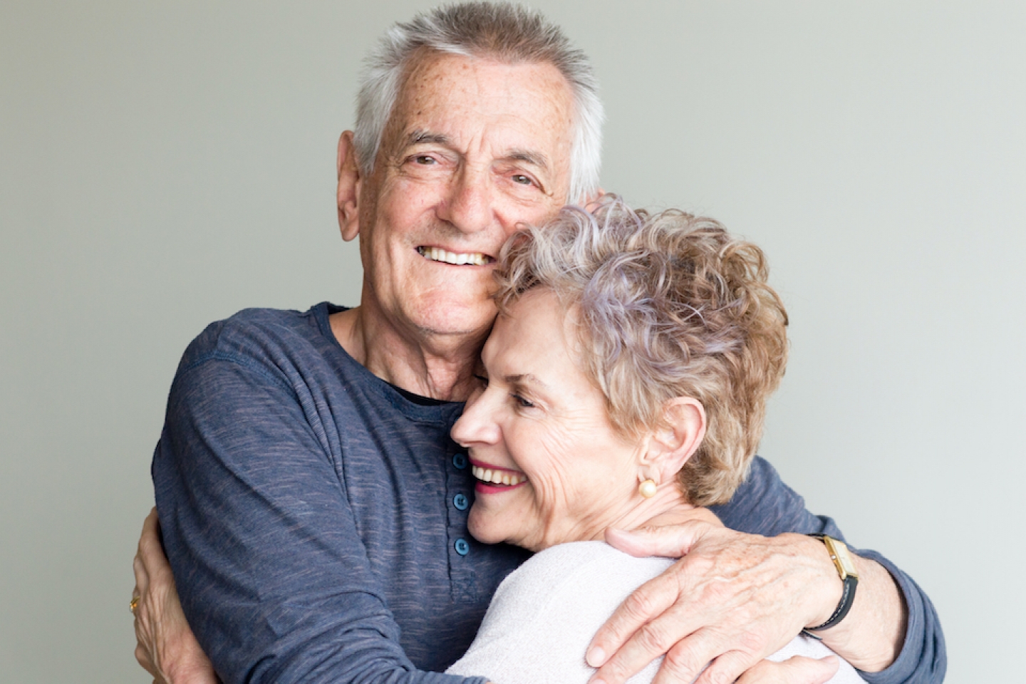 older couple hugging each other