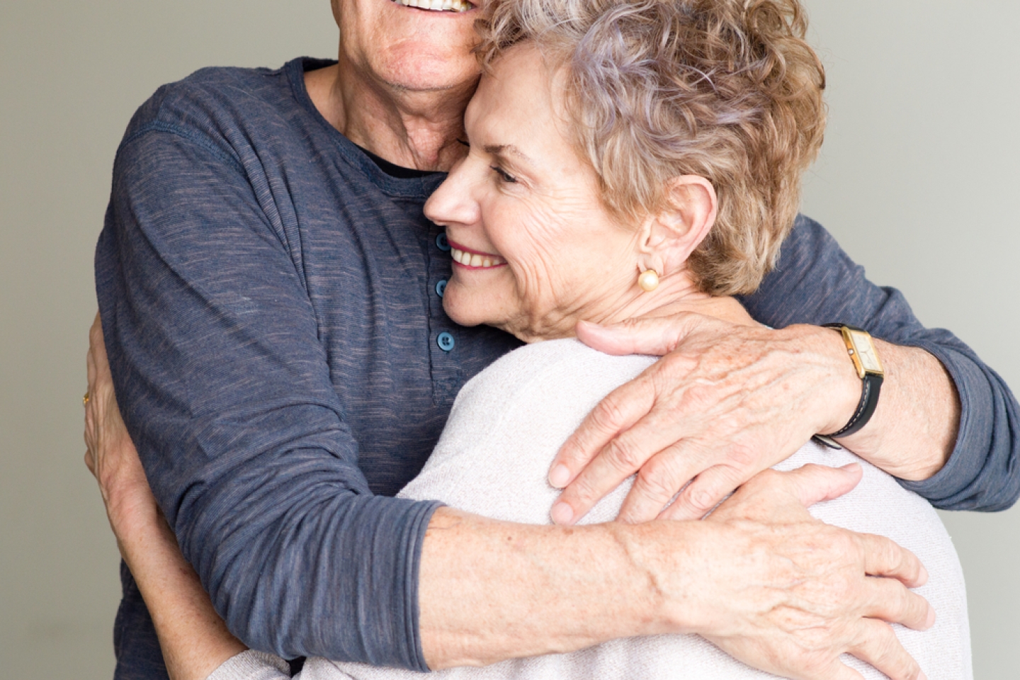 Older man and woman embracing