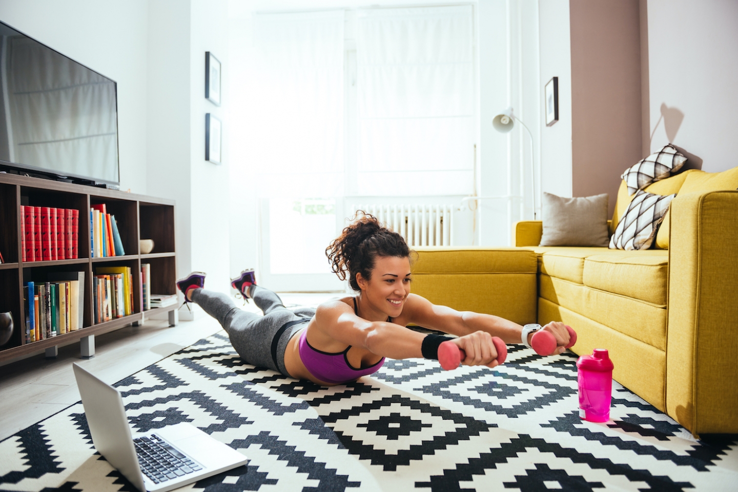 woman works out at home