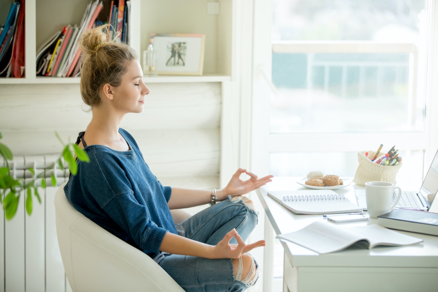 woman mediating at her desk