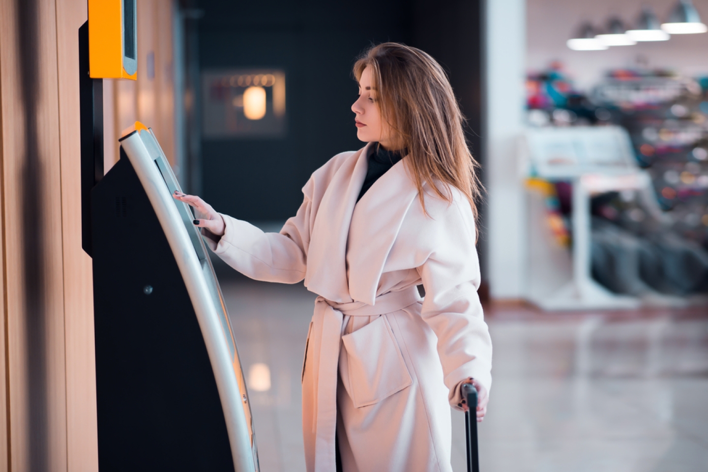 Young woman at self service transfer area.