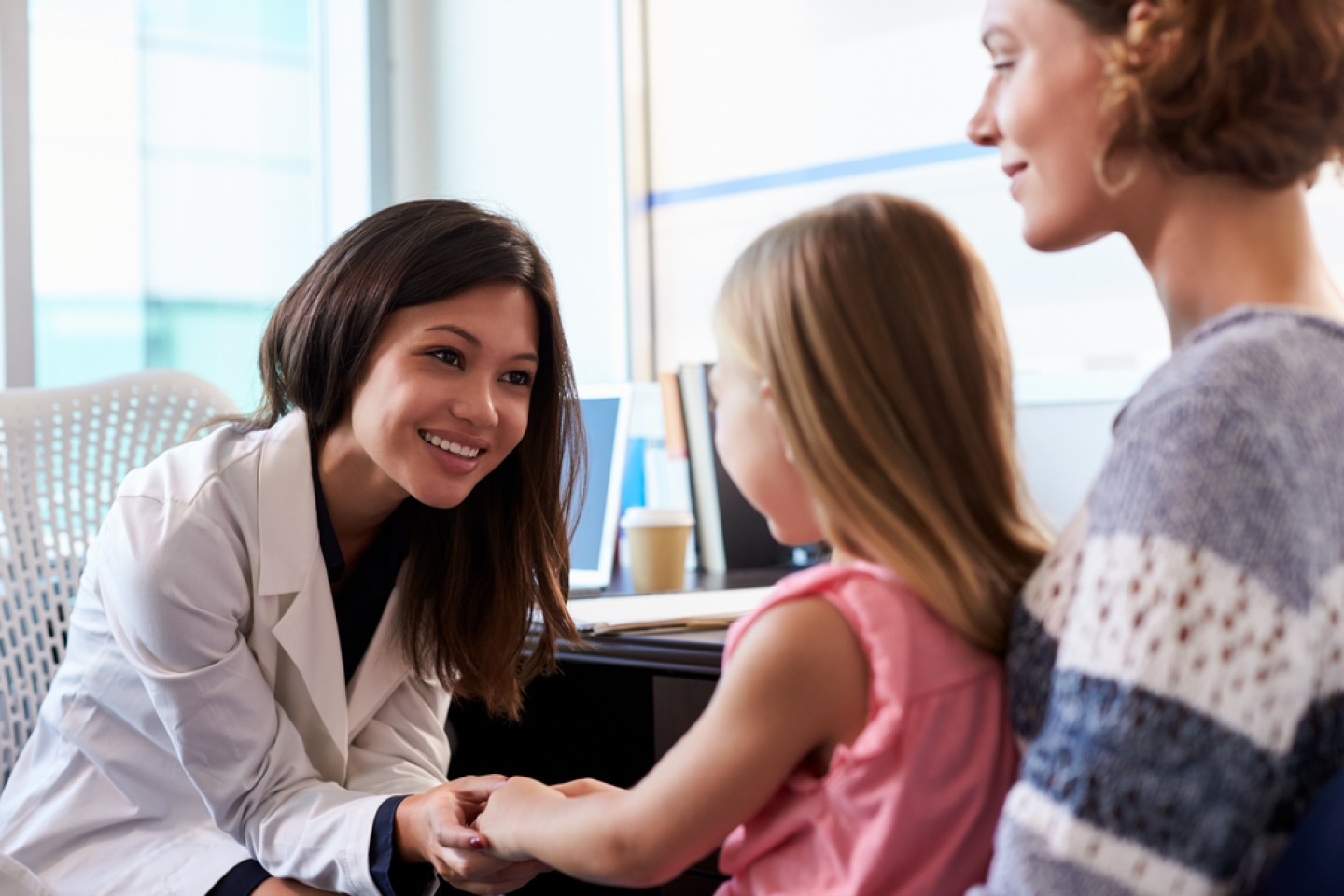 Pediatrician Meeting With Mother And Child