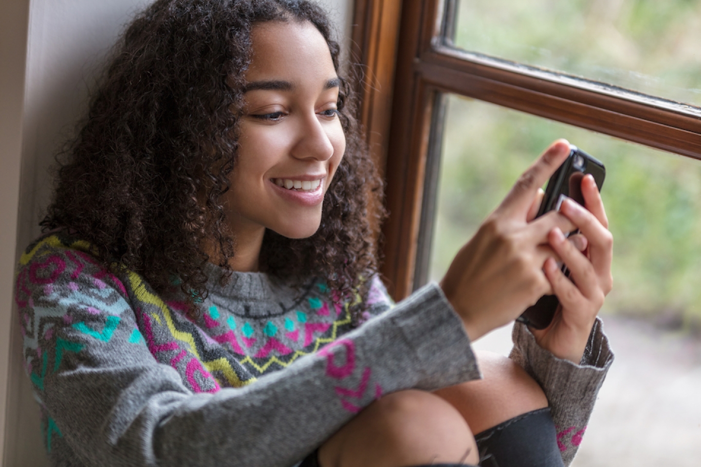 teenage girl on her phone