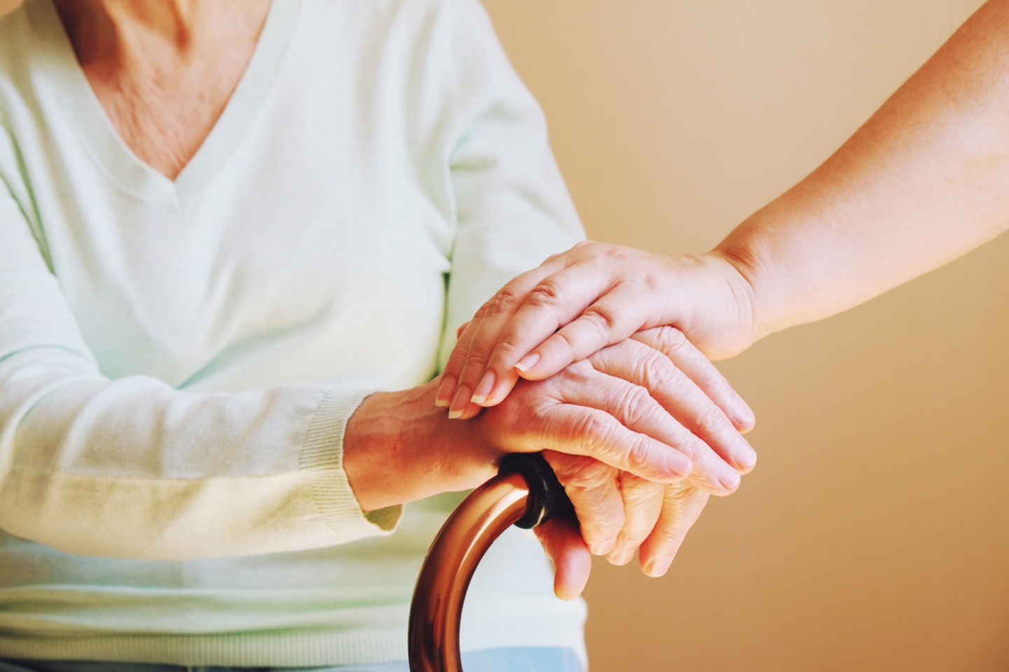 Senior woman with her caregiver at home.