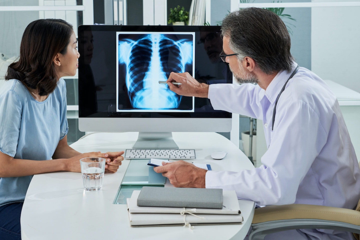 patient and doctor reviewing xray