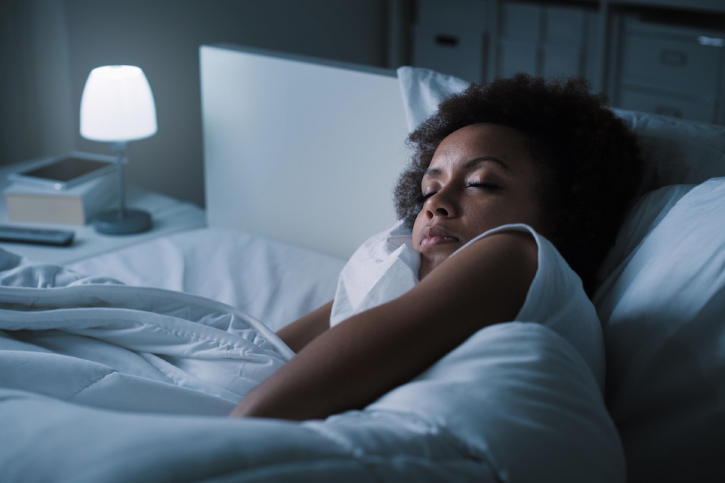 black woman sleeping in bed