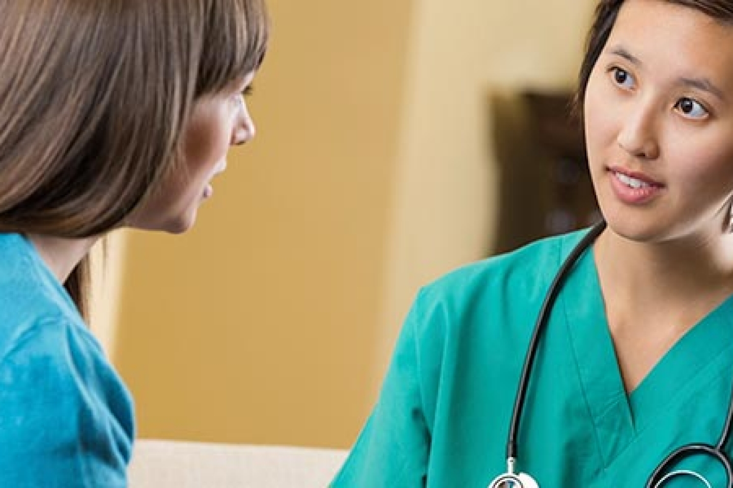 Doctor speaking to female patient