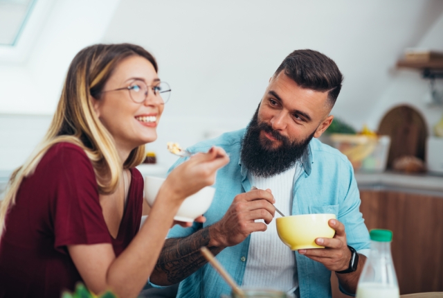 Shot of a young couple enjoying breakfast in the kitchen