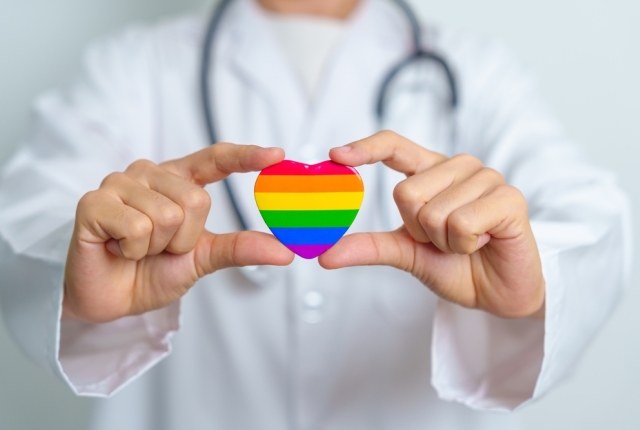 LGBT pride month or LGBTQ+ or LGBTQIA+ and health concept. Doctor with rainbow and colorful heart shape with for Lesbian, Gay, Bisexual, Transgender, Queer and Pansexual community