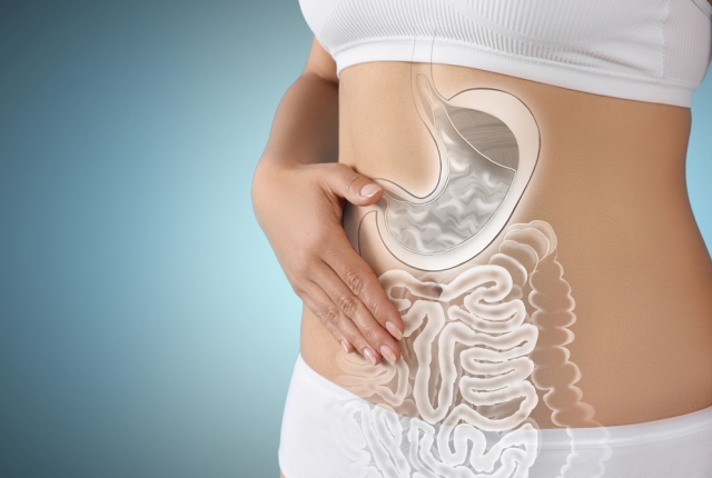 Woman with healthy digestive system on light blue background, closeup. Illustration of gastrointestinal tract