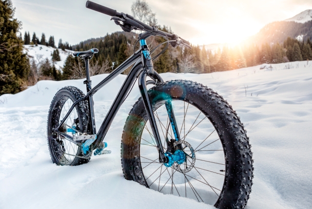 Fat-bike on the snowy mountain trail