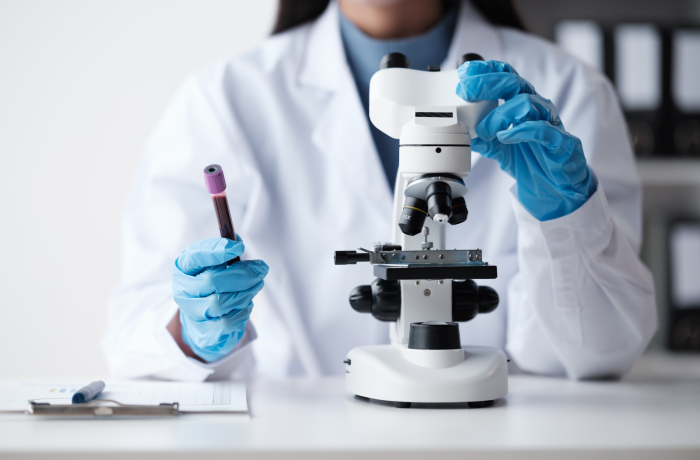 Scientist with a microscope