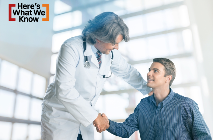 man shakes hand with his doctor