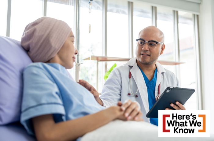 Male doctor visiting female cancer patient with care and compassion in hospital room