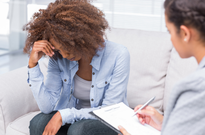 doctor taking notes with Patient