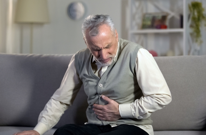 Old male having strong abdominal ache, stomach ulcer disease, health problems