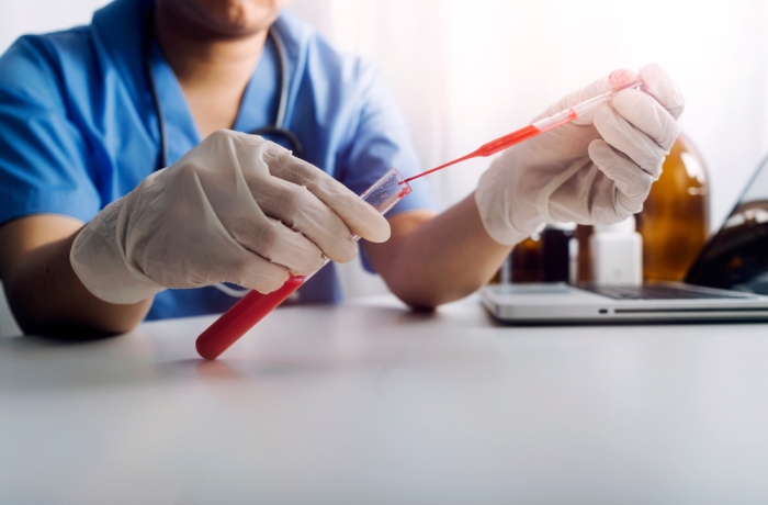 Concept fight against virus covid-19 corona virus, doctor or scientist in laboratory holding a syringe with liquid vaccines for children or older adults,Concept:diseases,medical care,science.