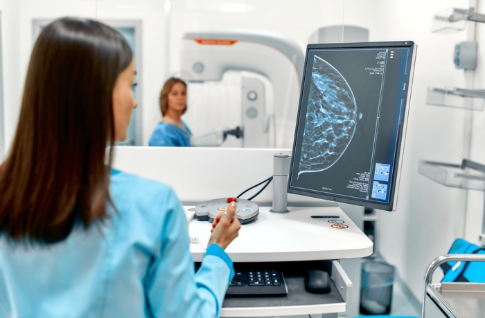 In the hospital, the patient undergoes a screening procedure for a mammogram, which is performed by a mammogram. A modern technologically advanced clinic with professional doctors.