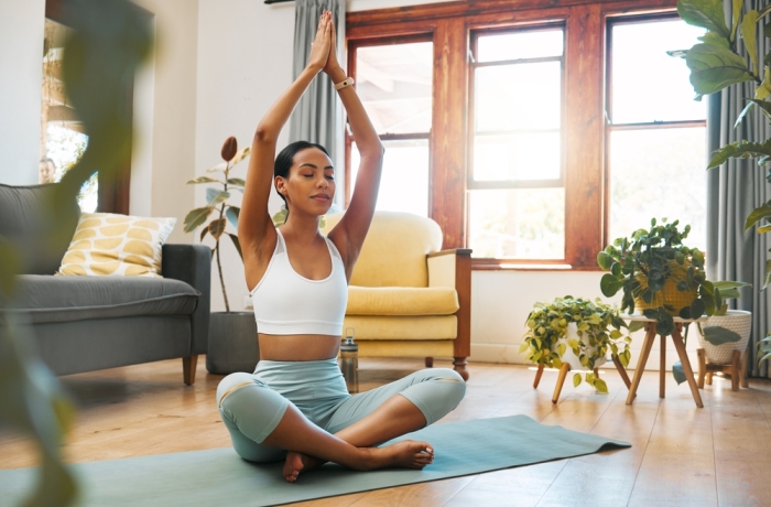 Yoga, woman and hands above head for meditation