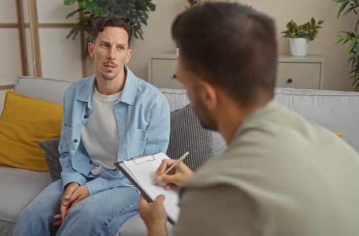 man speaking with doctor