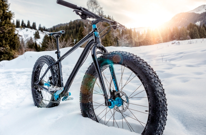 Fat-bike on the snowy mountain trail