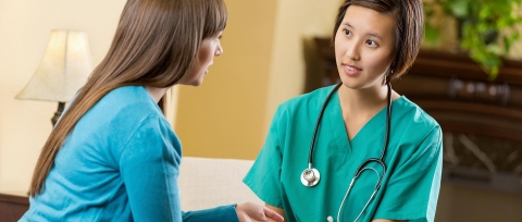 Doctor speaking to female patient