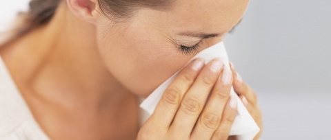 Woman Sneezing