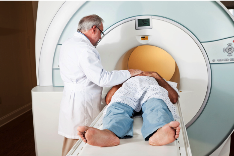 Male doctor lets patient into MRI machine