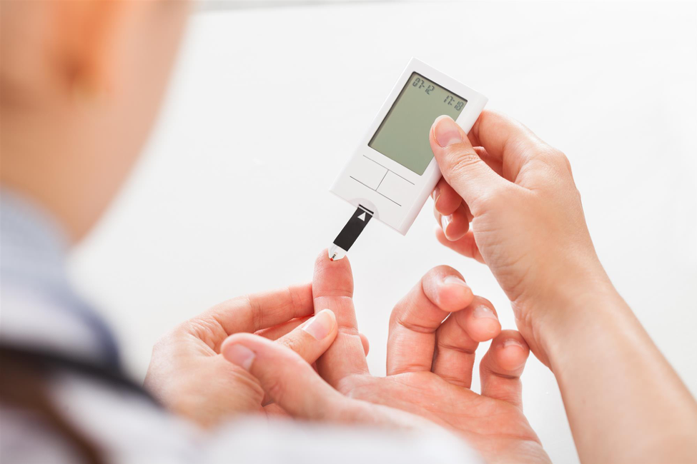 A patient tests their glucose level