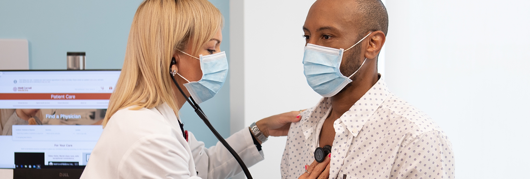 Weill Cornell Medicine doctor listening to patient's heart using a stethoscope