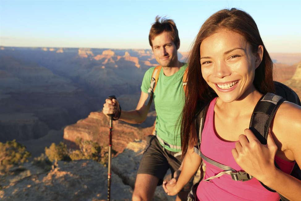 Man and woman hiking in mountains.