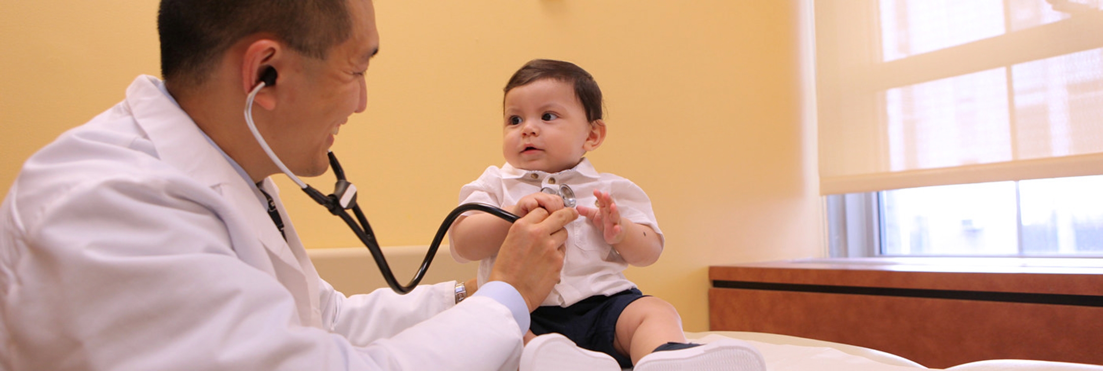 Weill Cornell Medicine physician examining young patient.