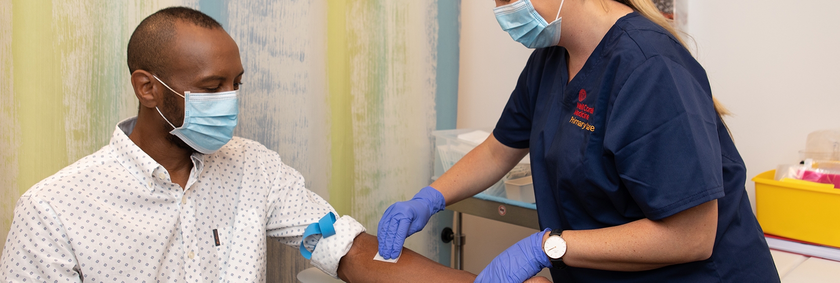 Weill Cornell Medicine nurse prepping a patient's arm for a blood draw.