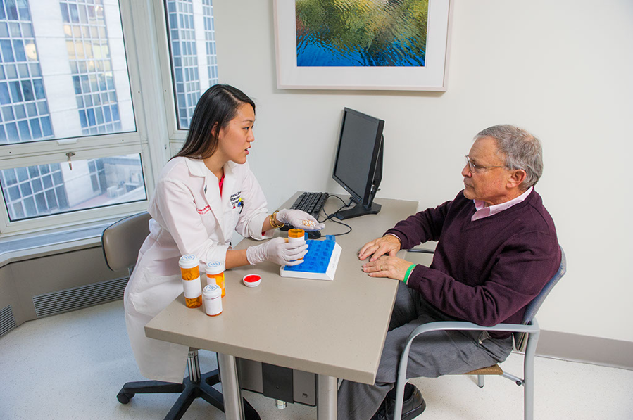 Transplant pharmacist with patient