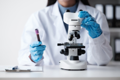 Scientist with a microscope