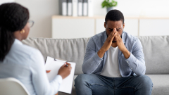 Doctor taking notes with Patient