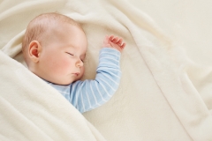 Infant sleeping on his back