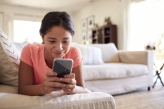 Teen girl using her cell phone