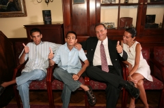 Brian and his wife, Evette, pose with their twin sons after each donating a kidney to their children.