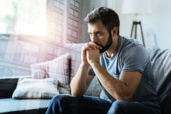 man contemplating at home