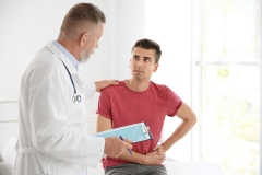 male patient meets with doctor