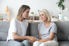 daughter consoles upset mother