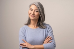 older woman folding arms cross